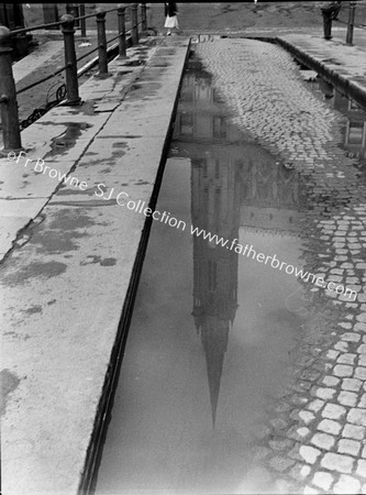 THE CATHEDRAL REFLECTED IN PUDDLE